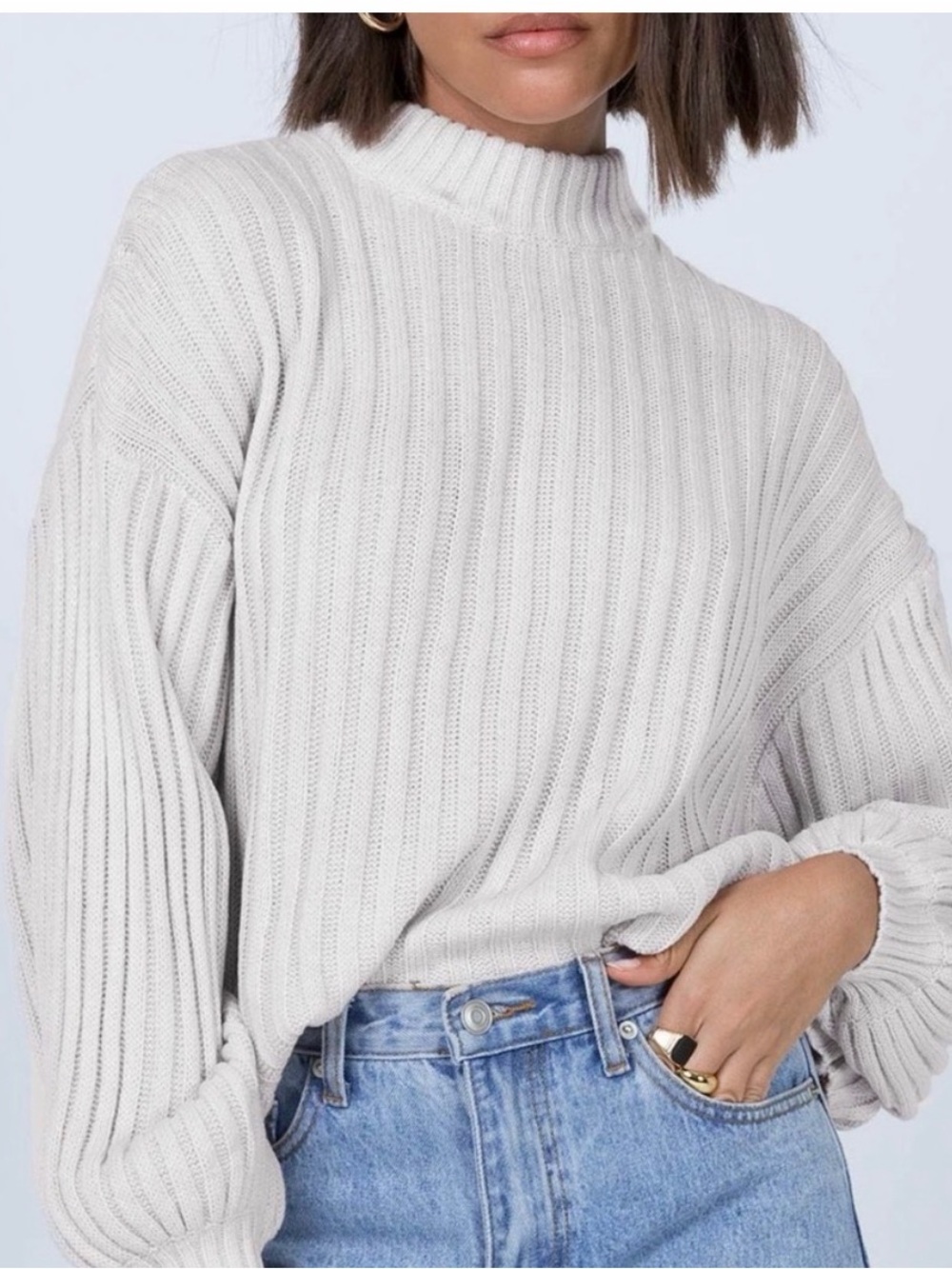 This Princess Polly beige sweater features a mock neck and ribbed knit design